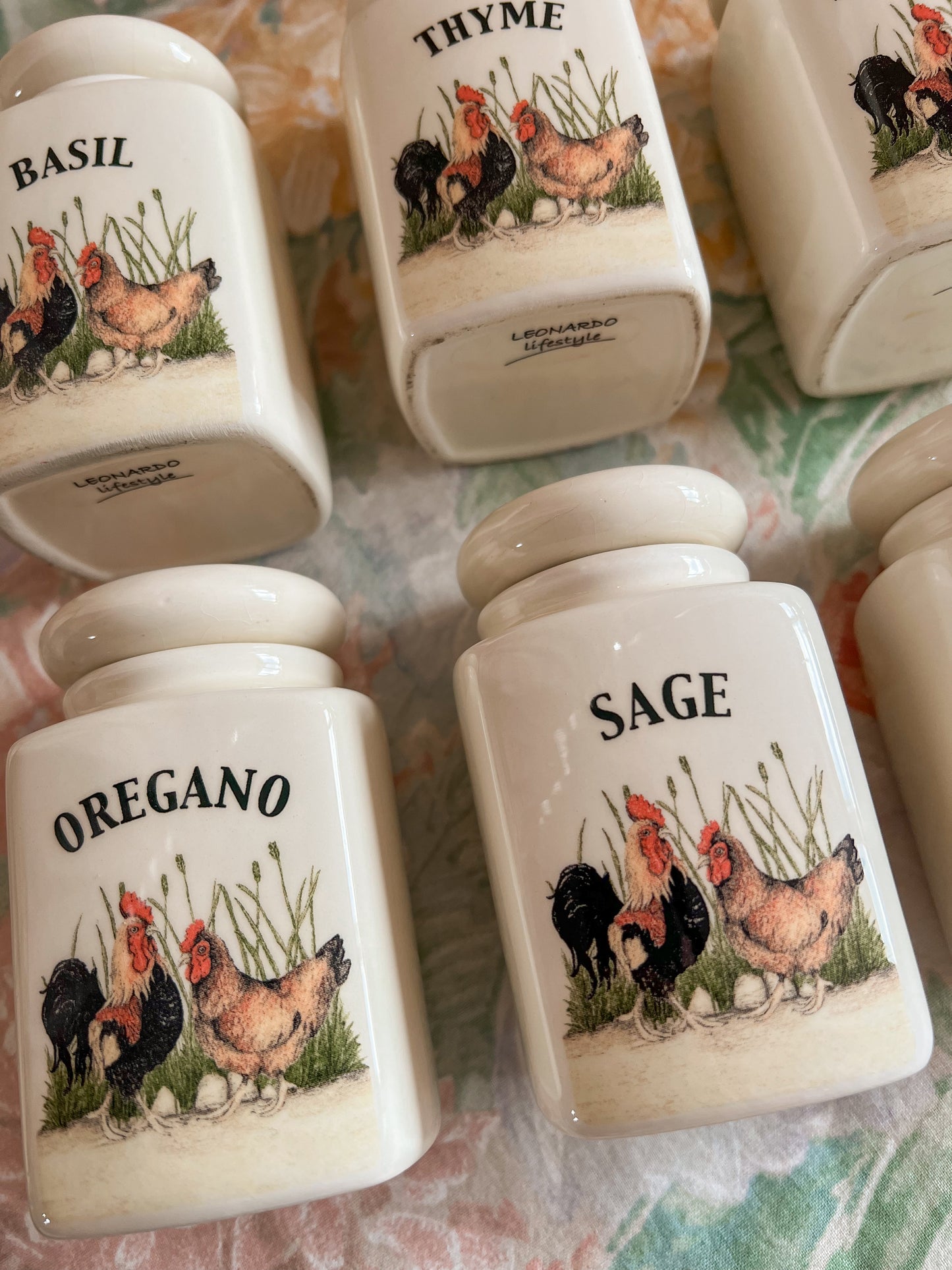 A set of 6 country kitchen herb jars.