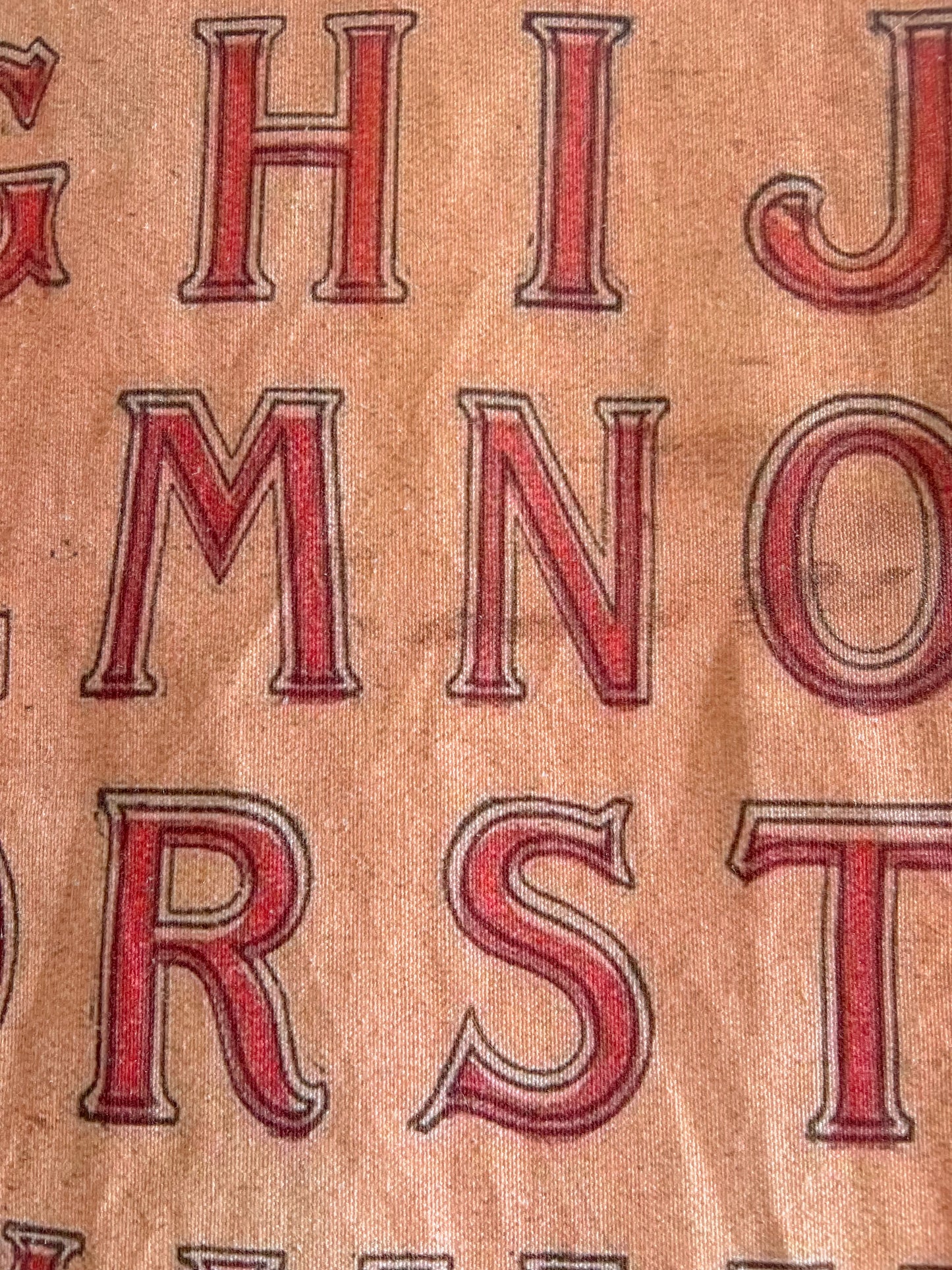 Vintage fabric alphabet wall hanging.