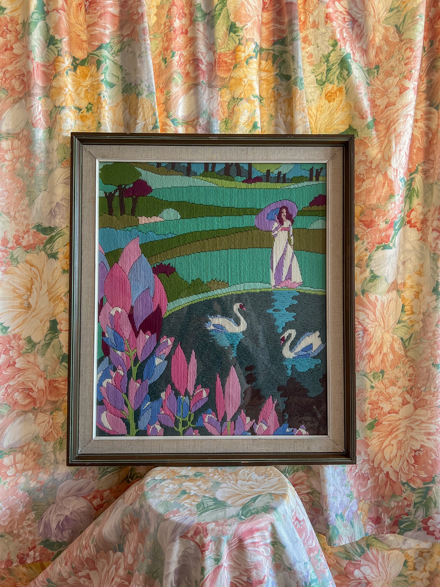 A large framed vintage swan embroidery.