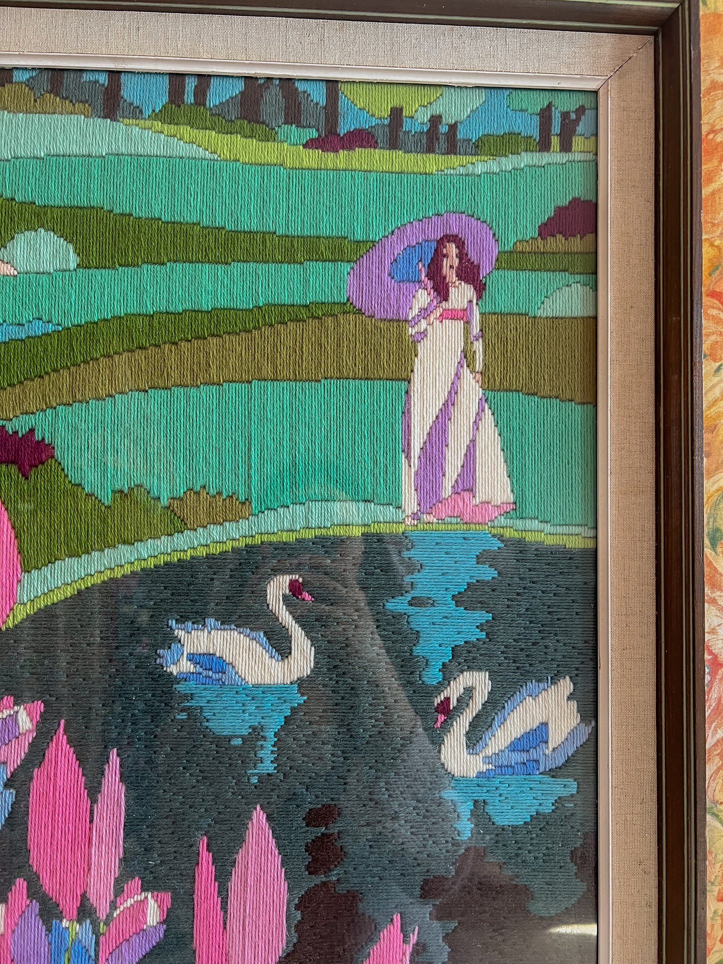 A large framed vintage swan embroidery.