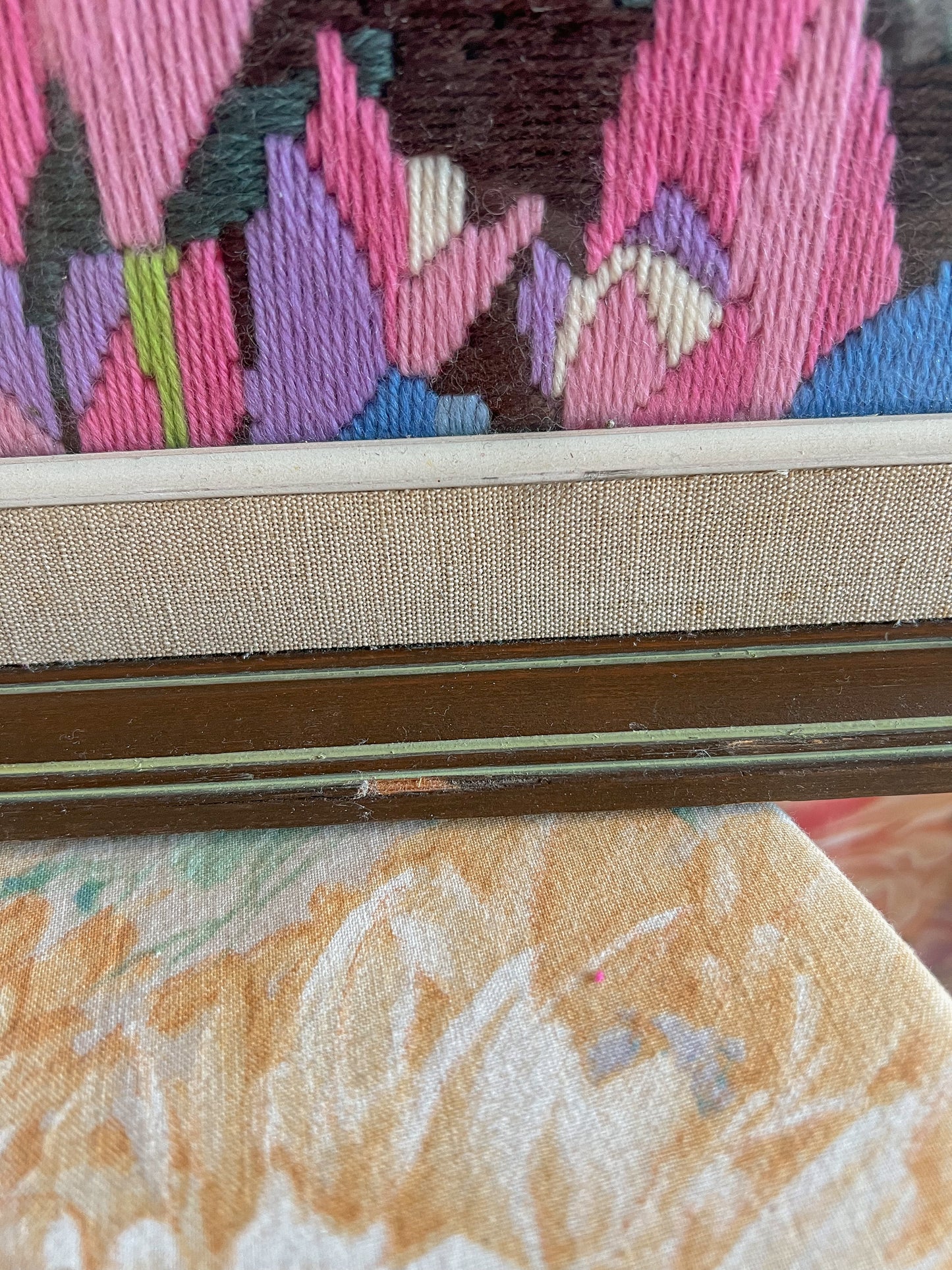 A large framed vintage swan embroidery.