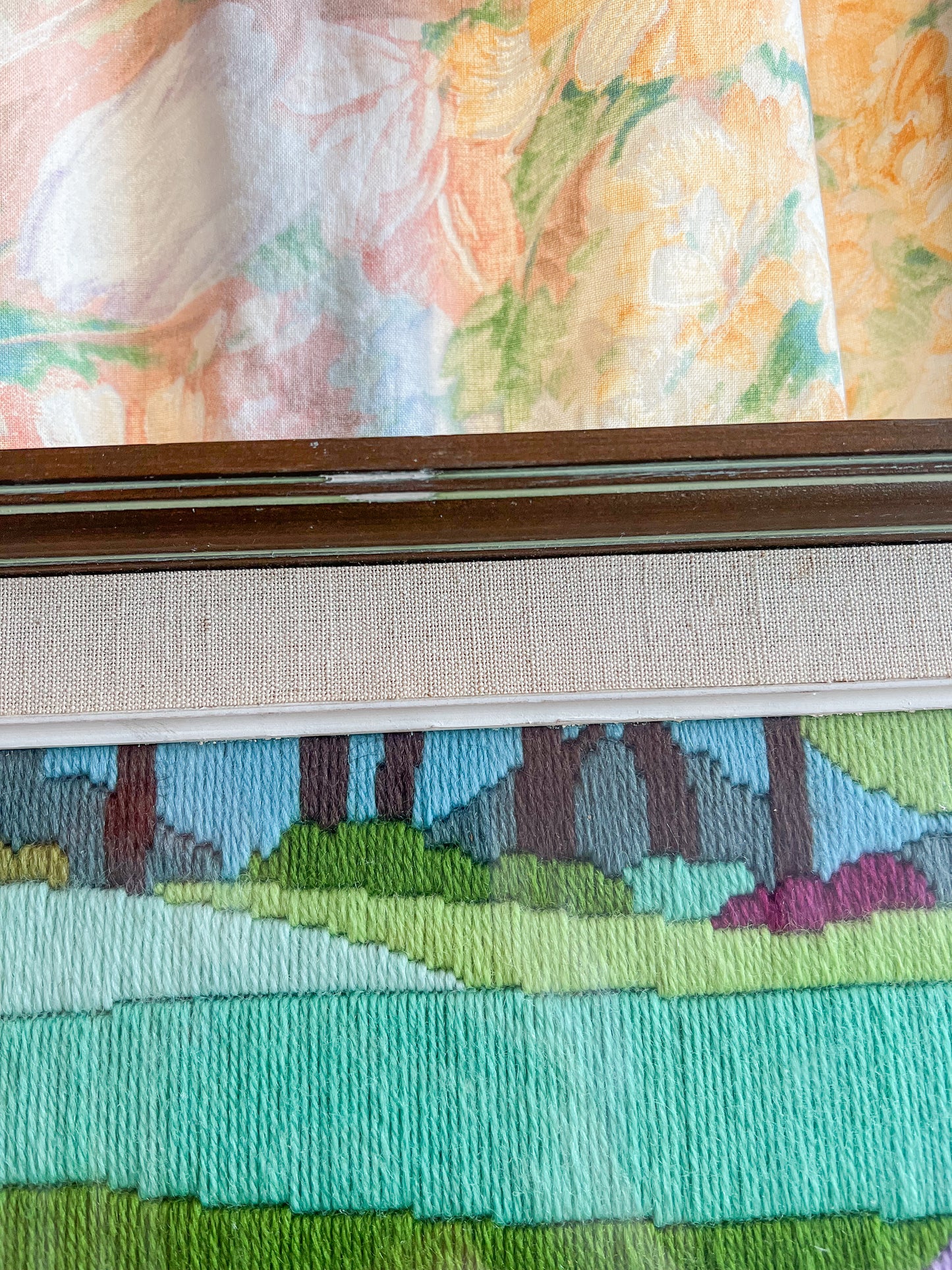 A large framed vintage swan embroidery.