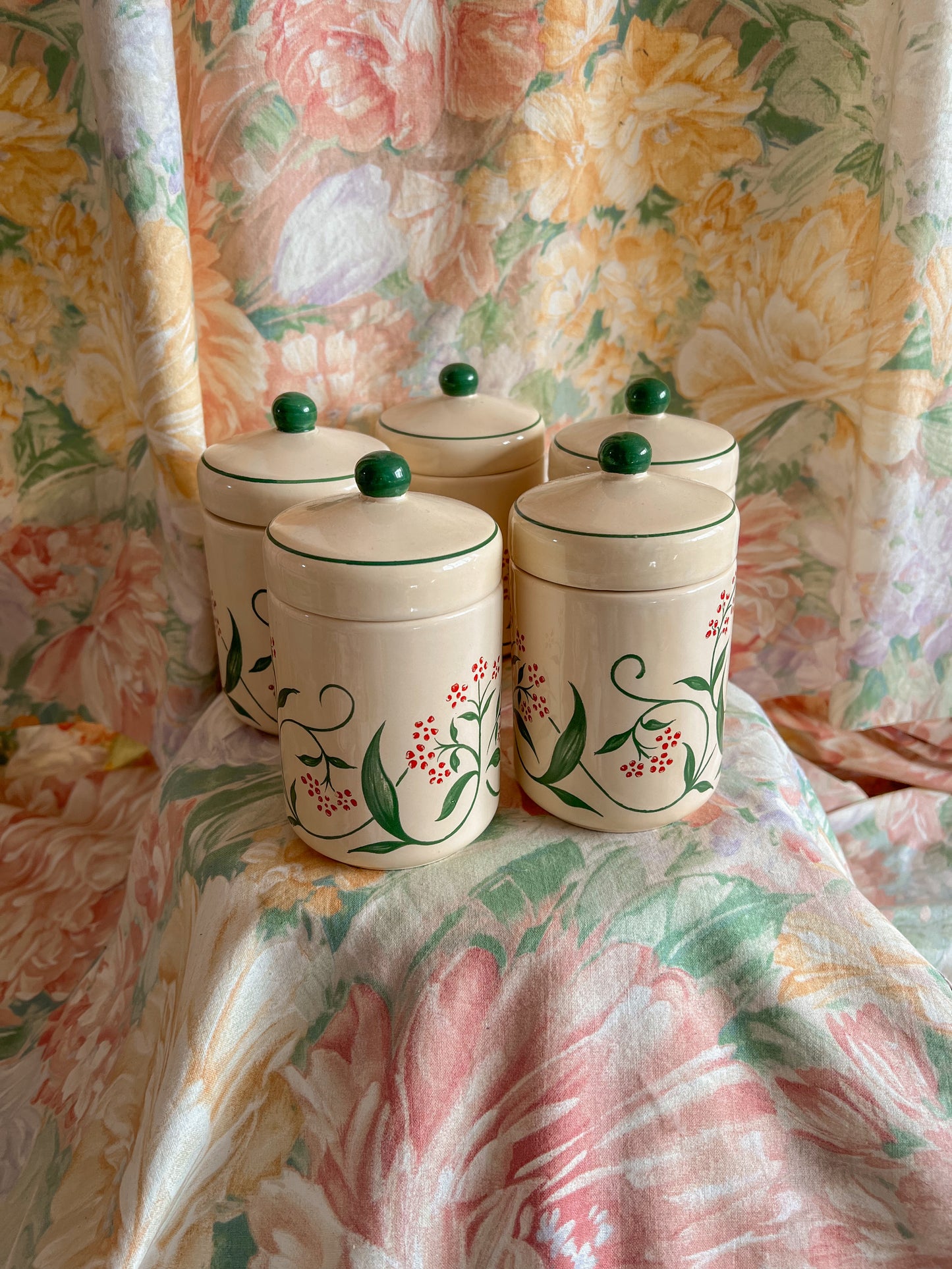 Set of five vintage kitchen canister jars.
