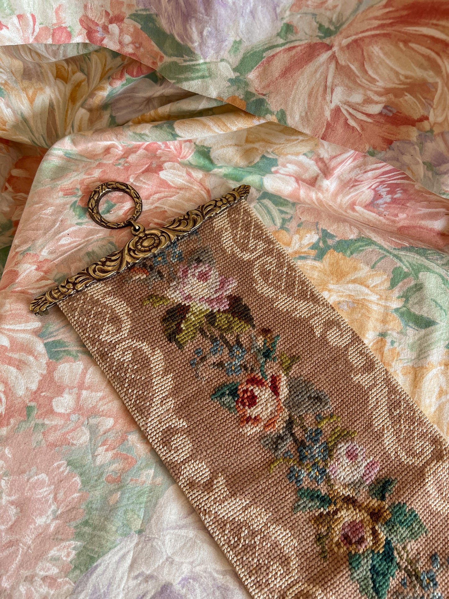 Vintage floral needlepoint wall hanging.