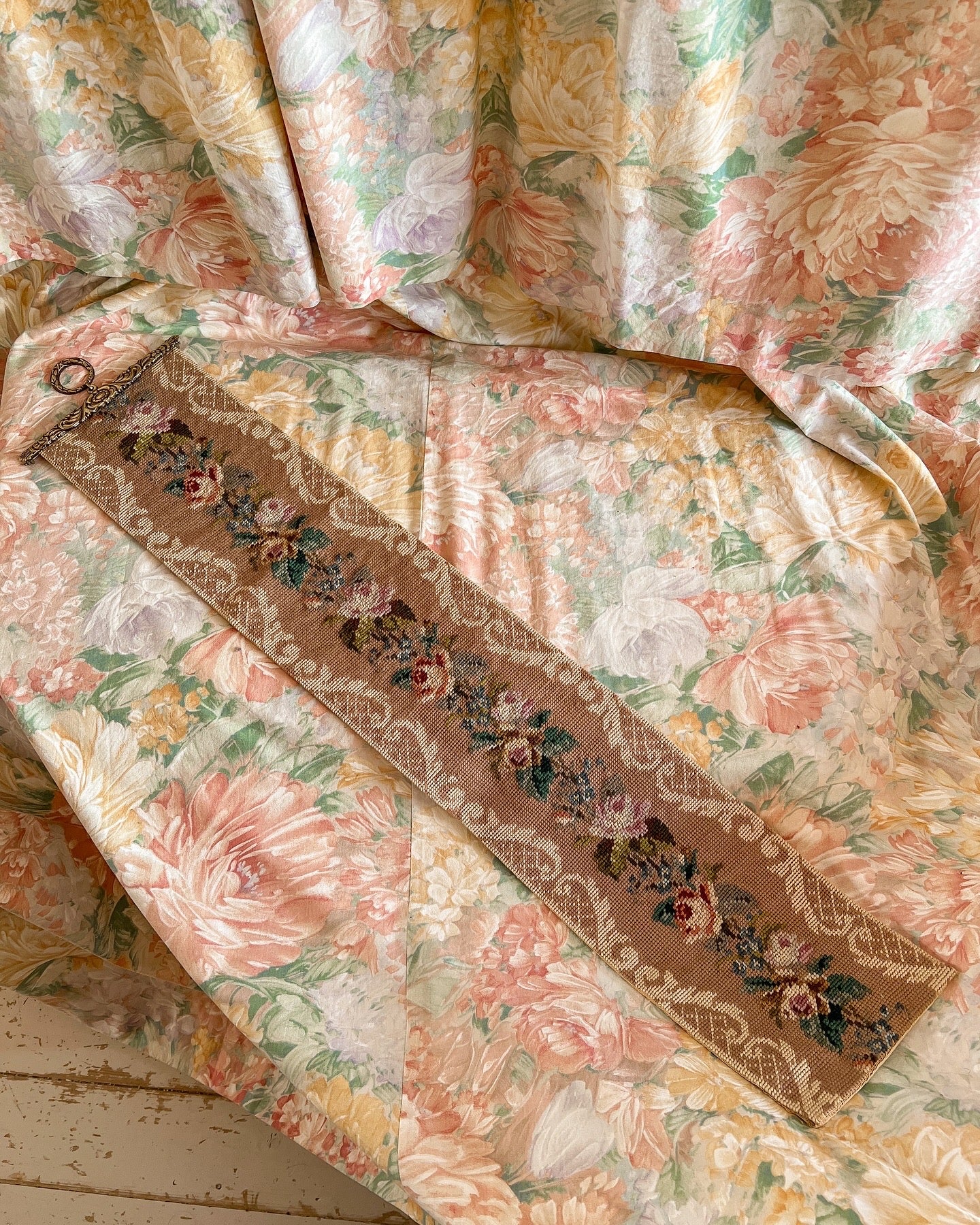 Vintage floral needlepoint wall hanging.