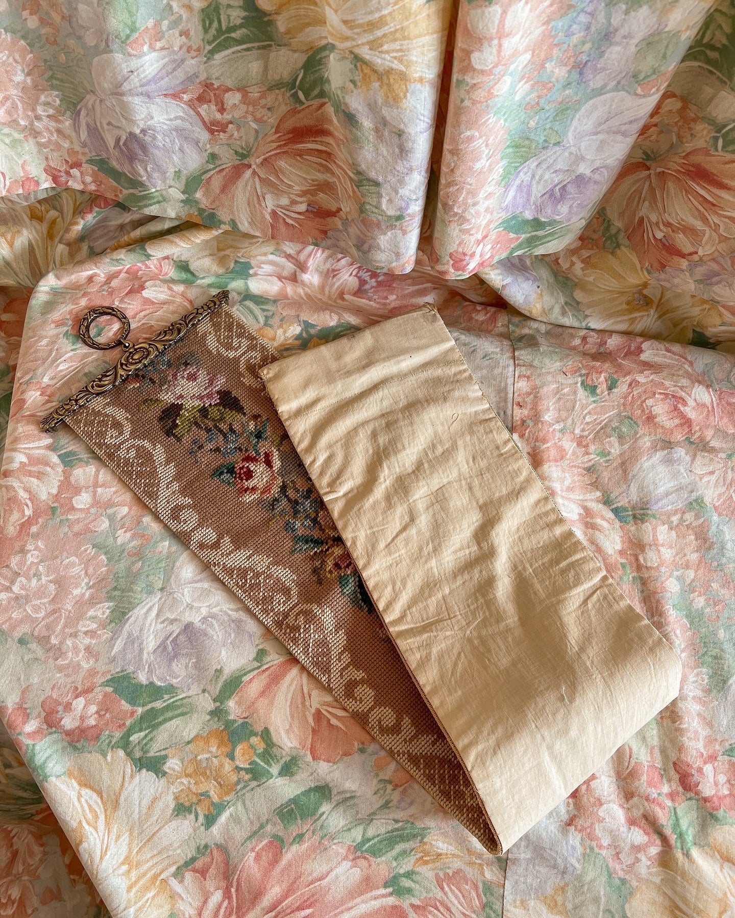 Vintage floral needlepoint wall hanging.