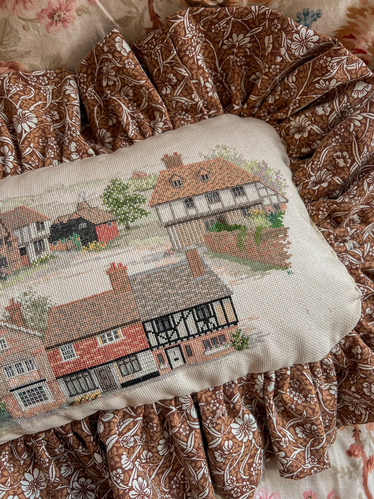 Vintage cottage needlepoint frill cushion.