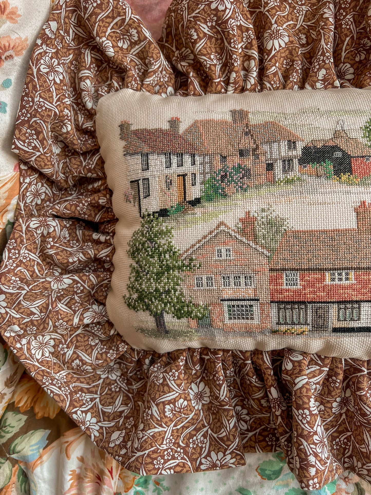 Vintage cottage needlepoint frill cushion.