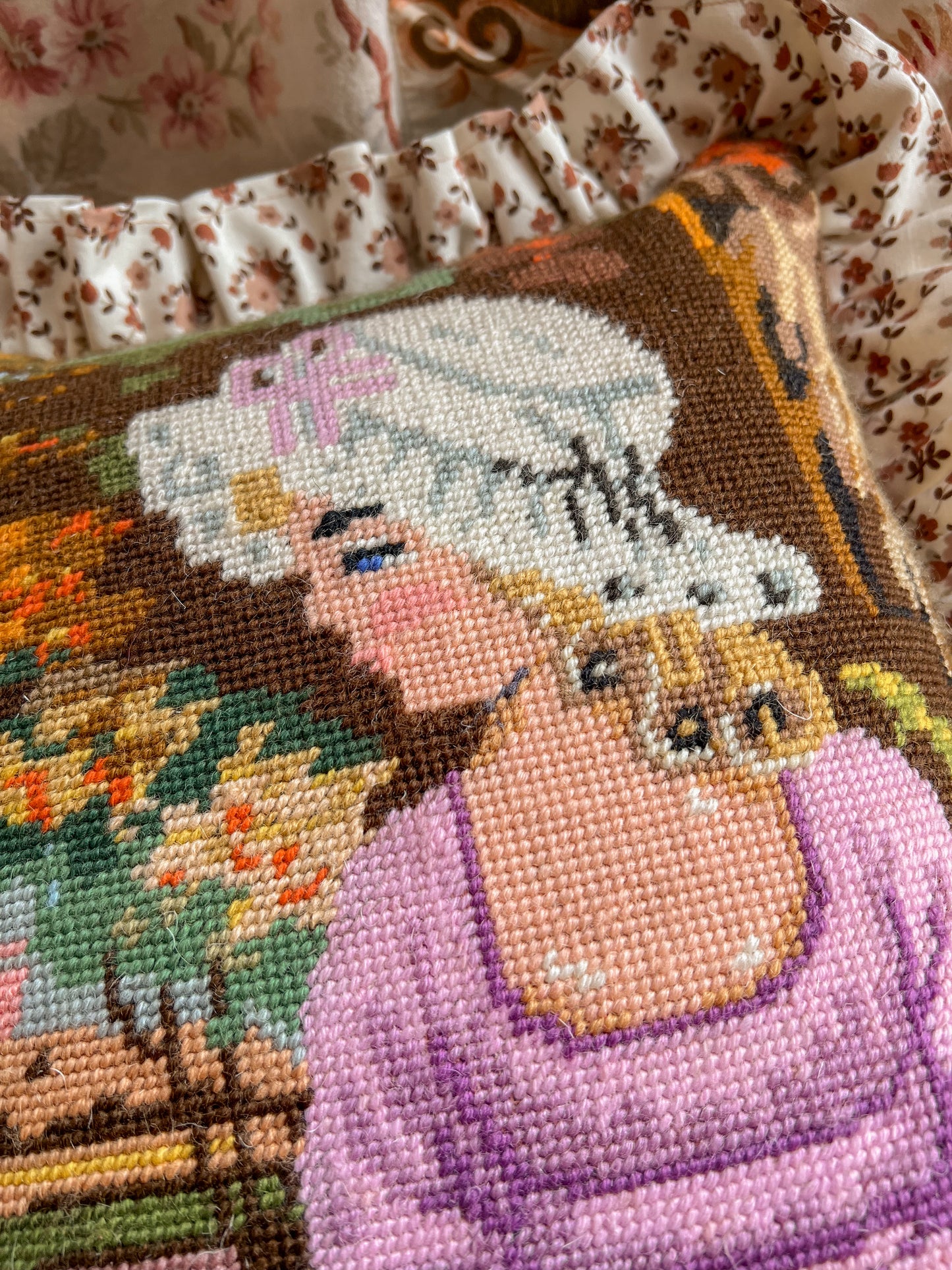 Vintage hand stitched needlepoint frill cushion.