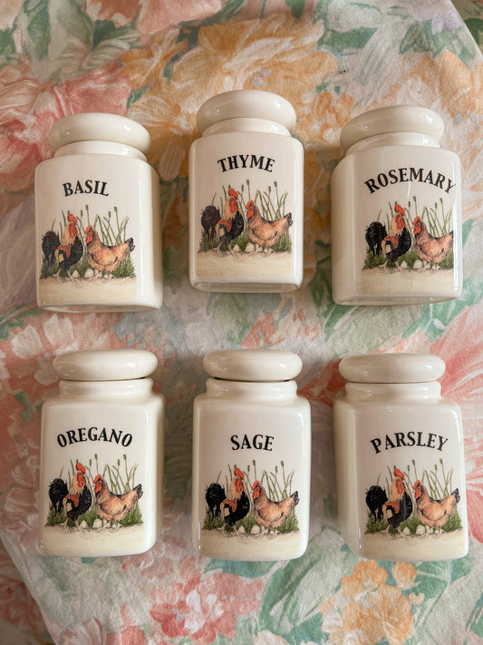 A set of 6 country kitchen herb jars.