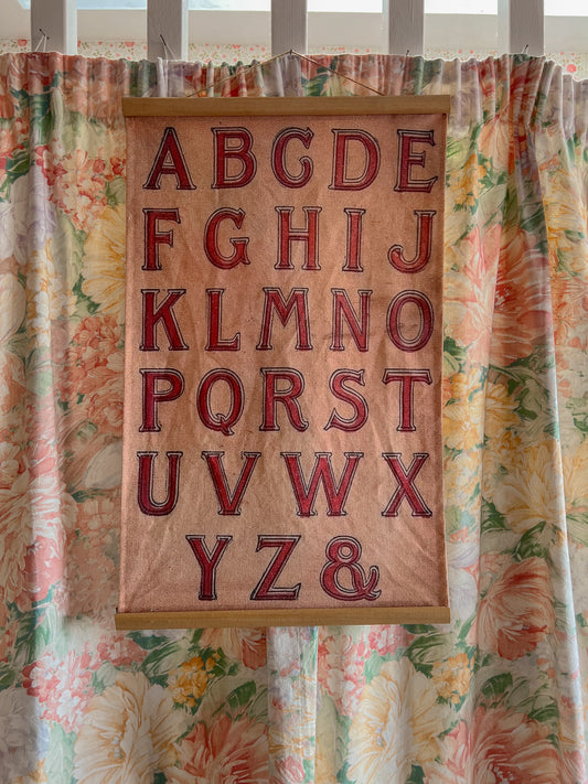 Vintage fabric alphabet wall hanging.