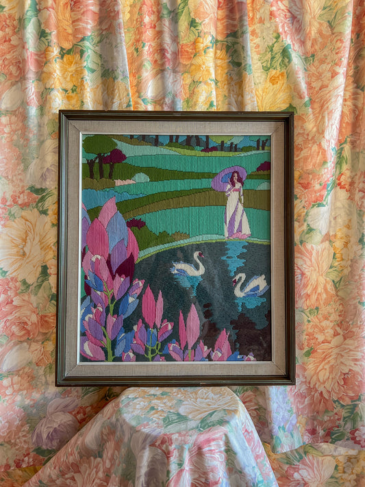 A large framed vintage swan embroidery.