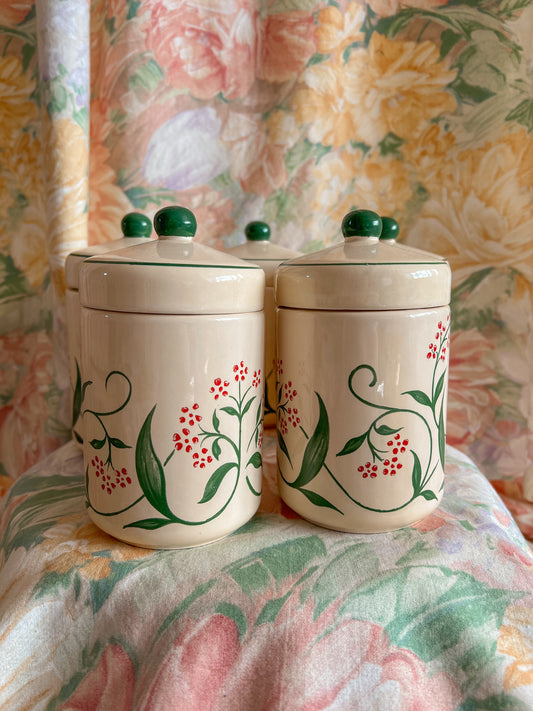 Set of five vintage kitchen canister jars.