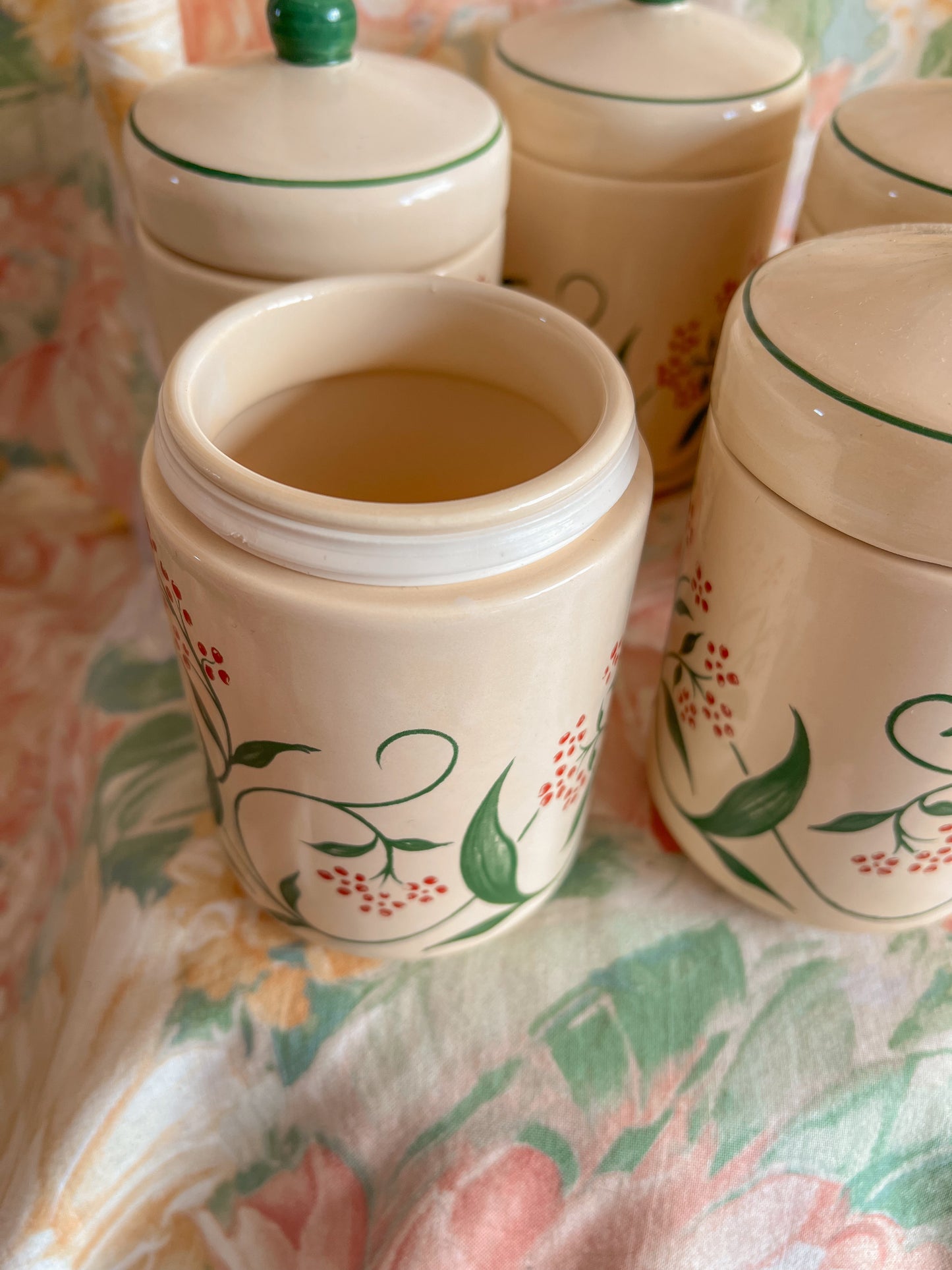 Set of five vintage kitchen canister jars.