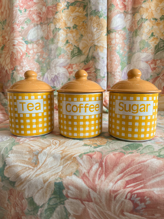 Vintage tea, coffee, and sugar gingham canister set.