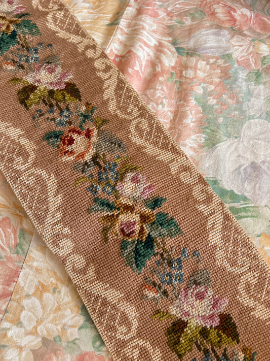 Vintage floral needlepoint wall hanging.