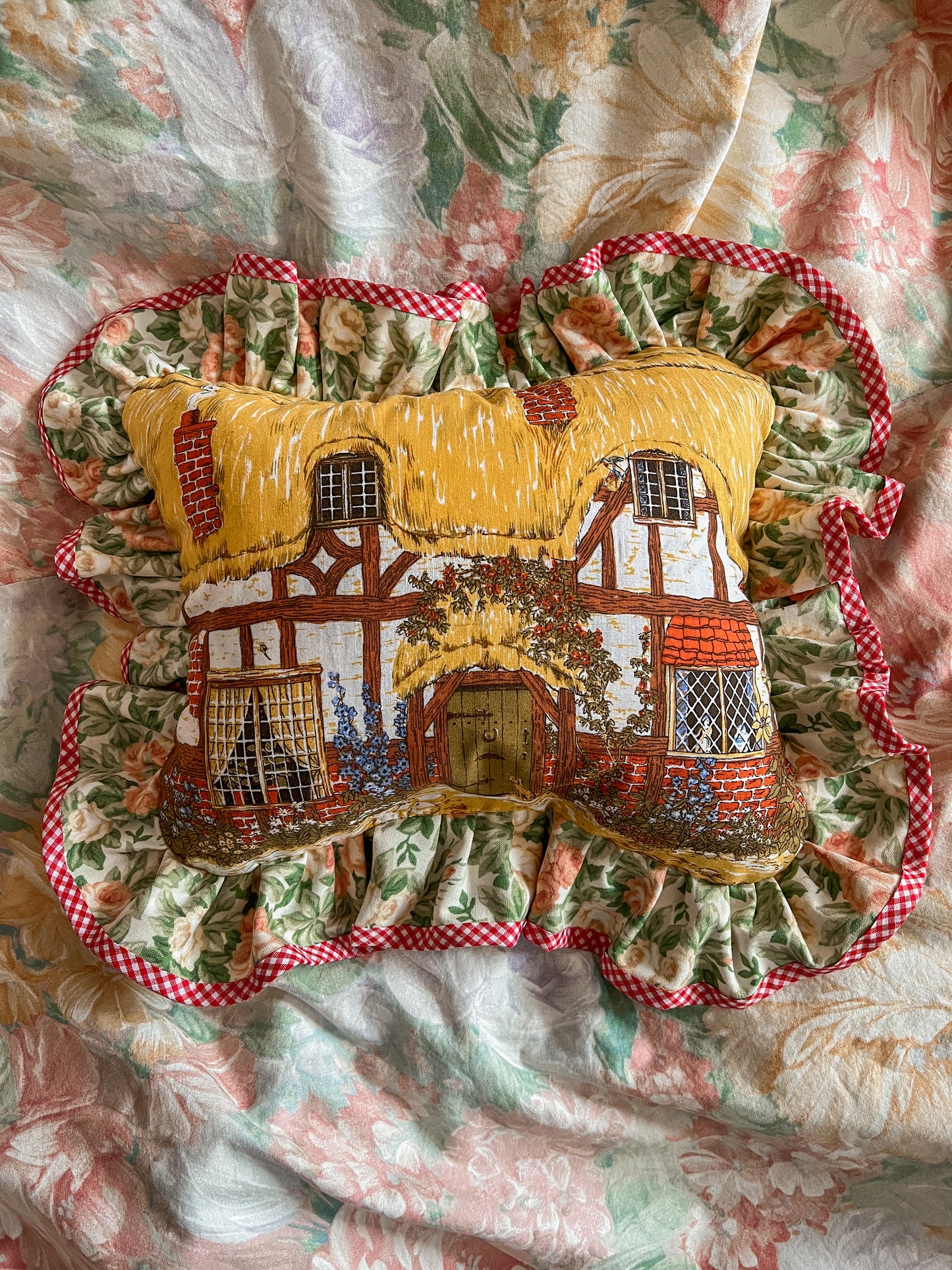 Hand stitched thatched cottage frill cushion.
