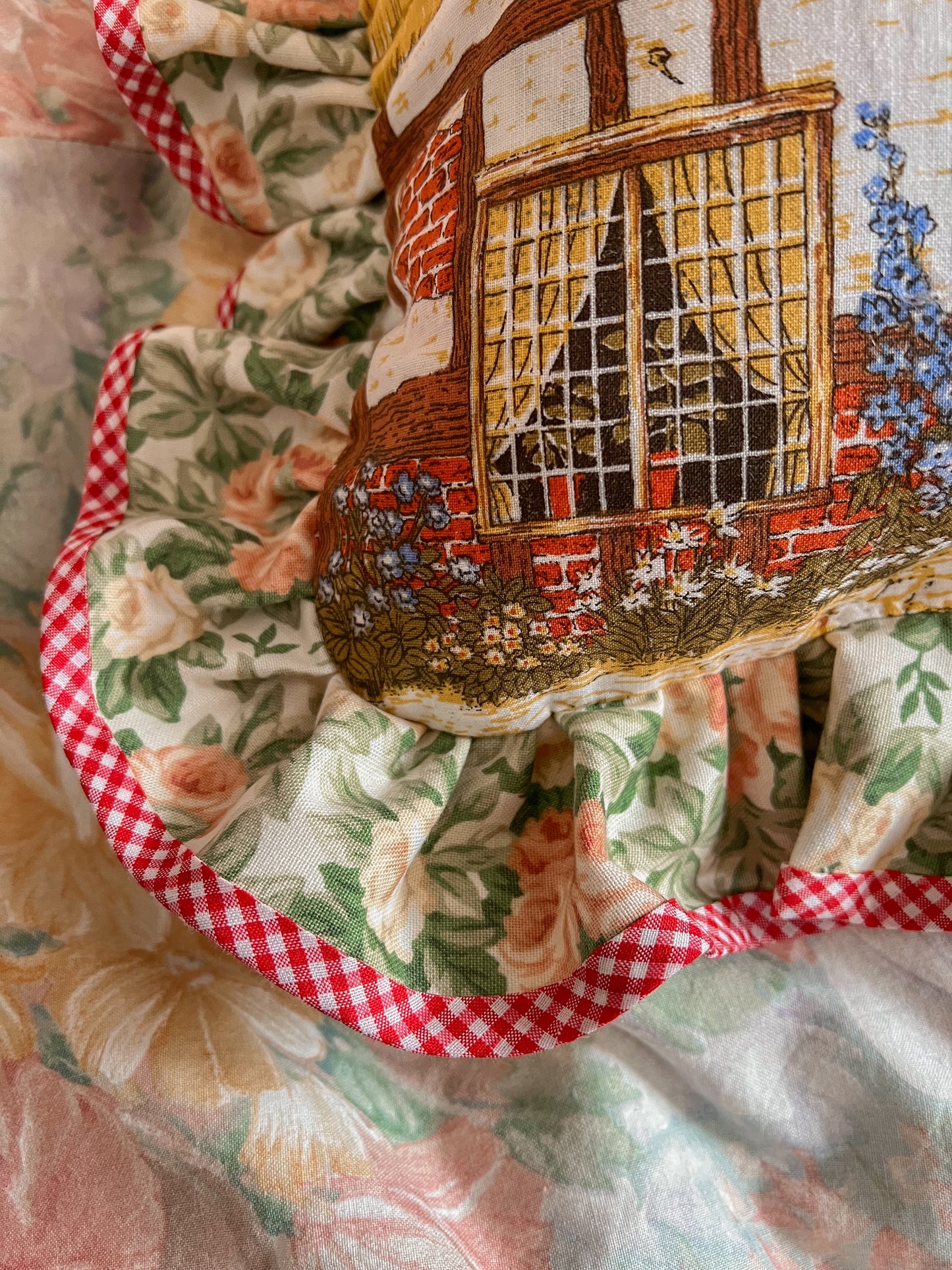 Hand stitched thatched cottage frill cushion.